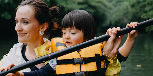 Southern Cross Health Insurance - Critical illness cover mobile banner A mother and daughter rowing in a canoe